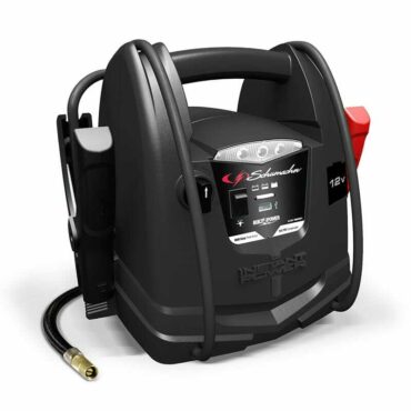 Schumacher Electric 1000 peak amp 12 volt jump starter with handle and color-coded clamps.